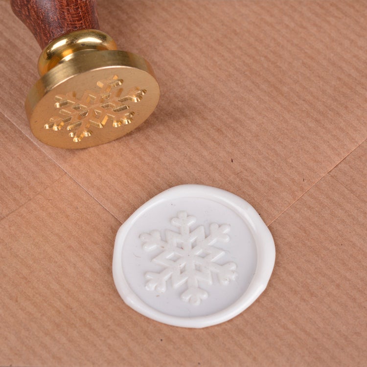 Signet med skaft, motiv snøfnugg