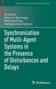 Synchronization of Multi-Agent Systems in the Presence of Disturbances and Delays